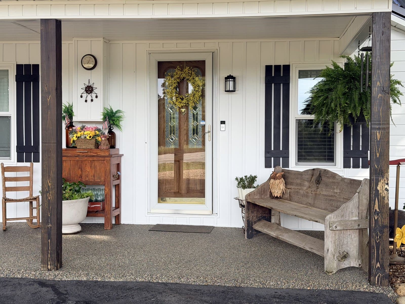 Speckled grey Resin Rock floor across a covered farmhouse porch